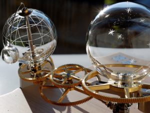 hand-blown glass orrery. mechanical glass mecanism. arts mecaniques. clock glass mecanism